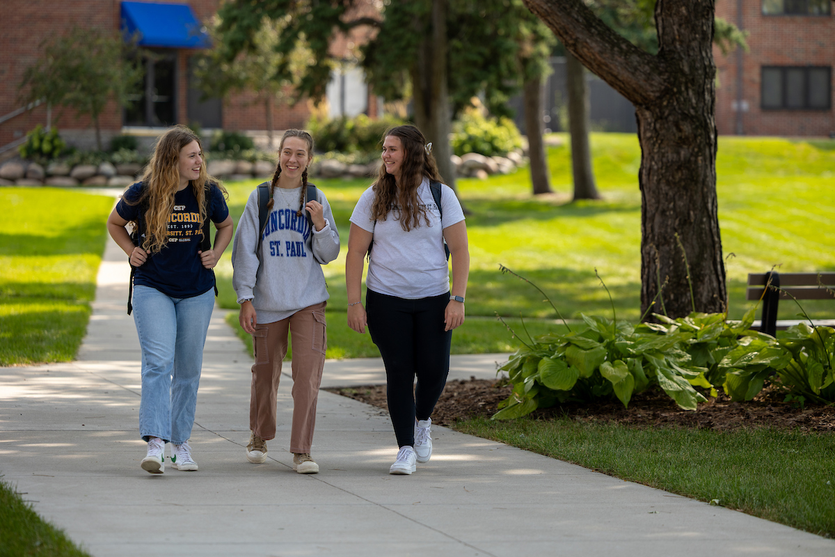 Three students walking outside on the CSP campus.