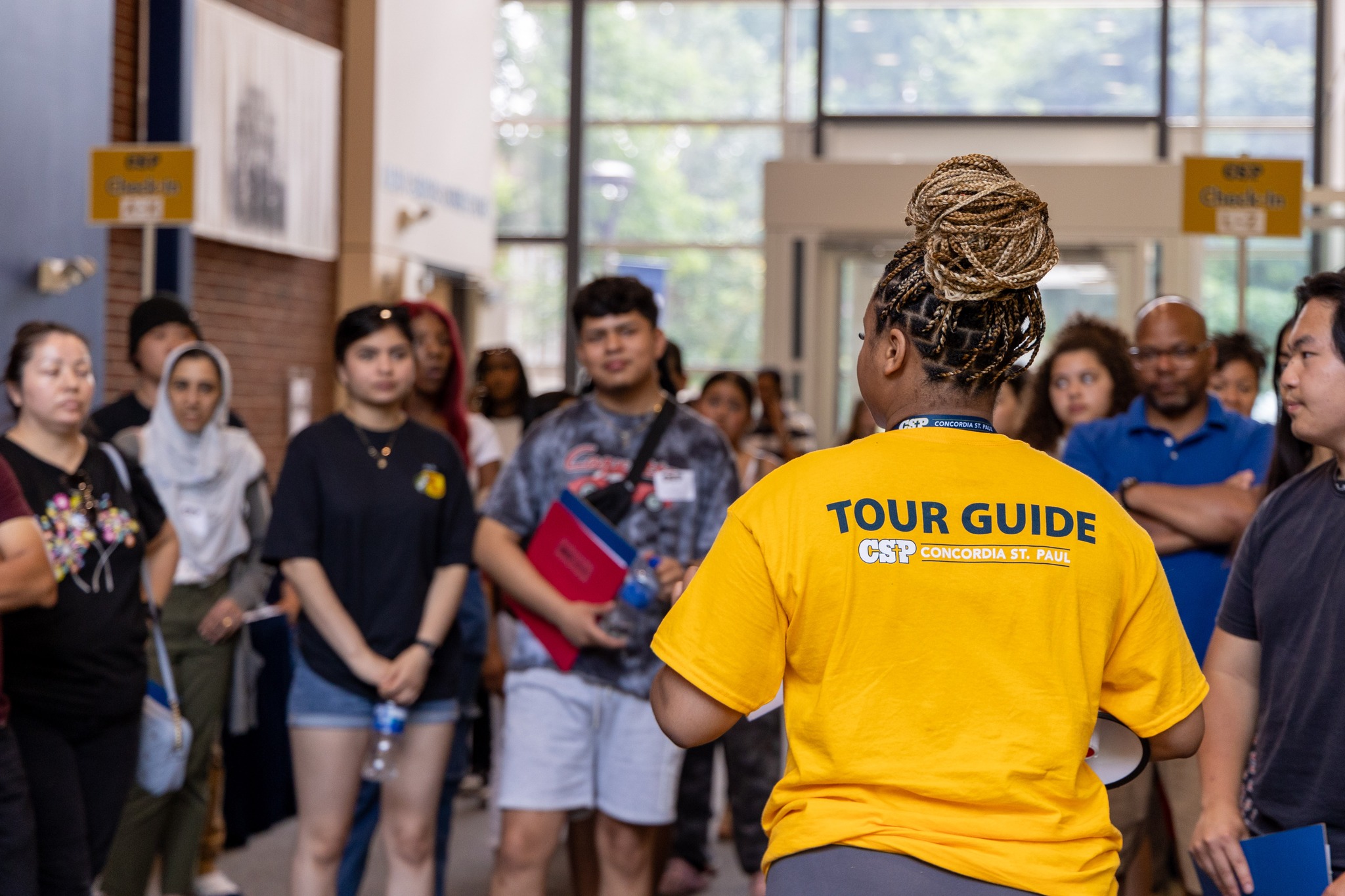 A tour guide speaking with a group of visitors.